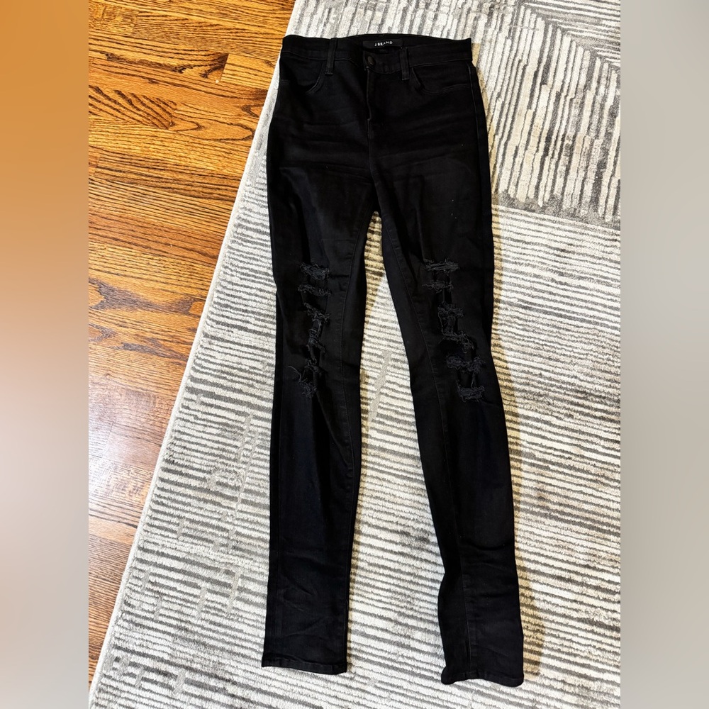 Black skinny jeans with rips down the leg